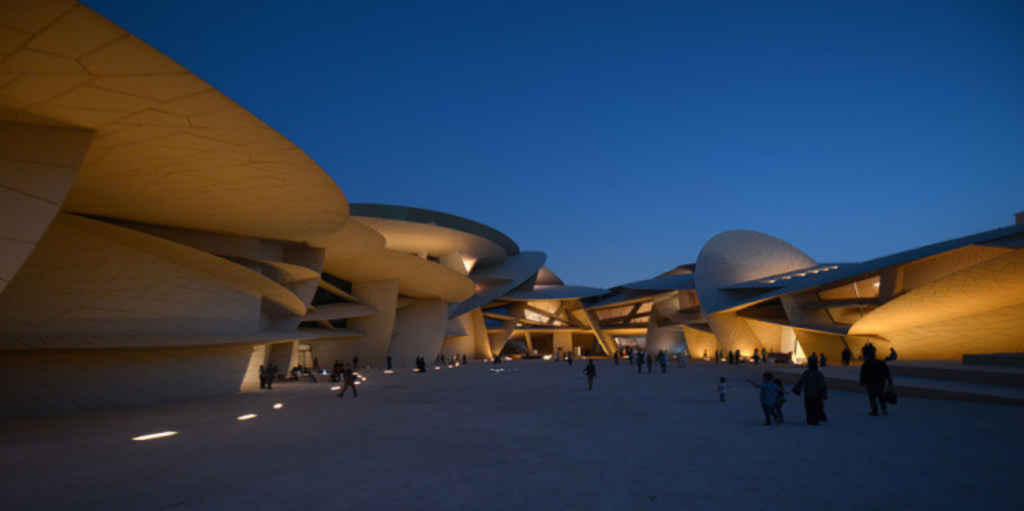 Projected museum content across curved gallery walls